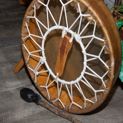 Back of the Roosebeck 14 inch frame drum showing the wooden handle, hoop and rawhide lacing