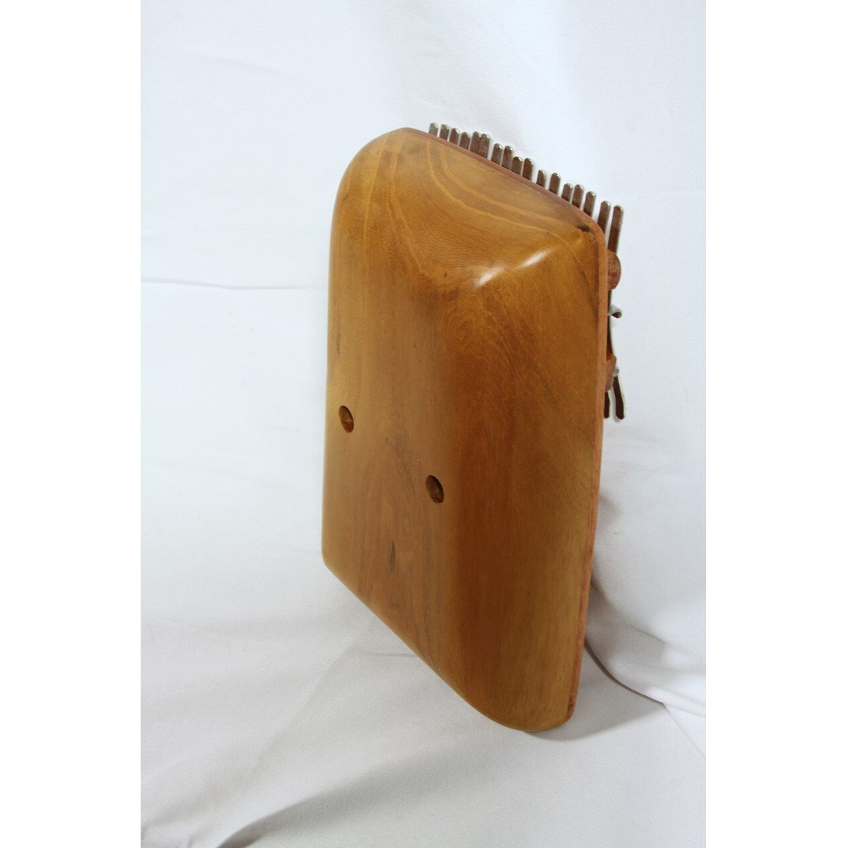 Rounded back of the Roosebeck red cedar kalimba