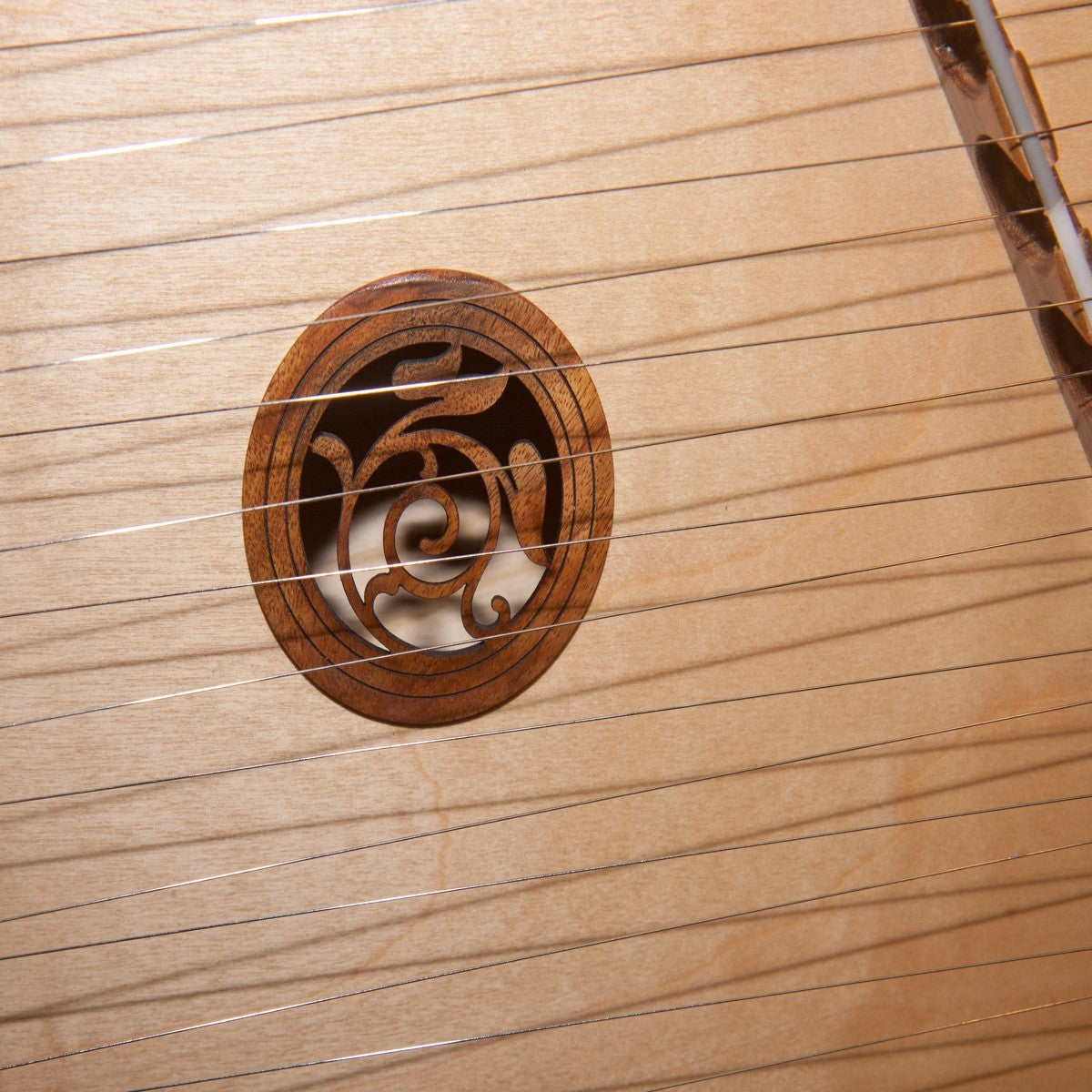 Roosebeck 10/9 Hammered Dulcimer, close-up of the carved soundhole rosette